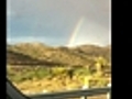 Full Rainbow Over the Desert Outside of Las  | BahVideo.com