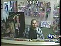 Robber takes more than money at adult store | BahVideo.com