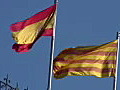 Royalty Free Stock Video HD Footage Zoom Out From Top of Office Building and Flags in Barcelona Spain | BahVideo.com