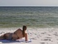 Woman In Bikini Reclining At Beach | BahVideo.com