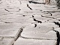 man s feet on cracked desert earth | BahVideo.com