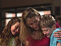 Happy family look through a book  | BahVideo.com