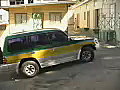 Stock Video Car Departs from a Parking Lot on the Island of Tobago Royalty-Free SD Footage | BahVideo.com