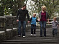 Family playfully hop down stairs  | BahVideo.com
