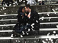 Couple sit on steps and hold each other  | BahVideo.com
