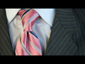 How to tie a double Windsor knot | BahVideo.com