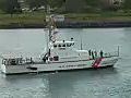 Royalty Free Stock Video HD Footage US Coast Guard Cutter Passing by at the Port of Honolulu Hawaii | BahVideo.com