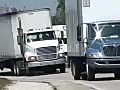 Royalty Free Stock Video HD Footage Tractor Trailer Trucks Pass by on a Curve in Florida | BahVideo.com