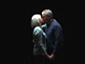 Senior couple kiss and smile at camera  | BahVideo.com