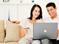 Young Couple Sharing a Laptop | BahVideo.com
