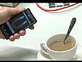 Guy stirs tea using amazing Magnet App - www facebook com LGmobileAus | BahVideo.com