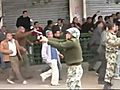 EGYPT SOLDIERS WITH HAND-GUN MAN TO MAN AGAINST CROWD WITHOUT WEAPON  | BahVideo.com