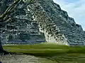 Royalty Free Stock Video SD Footage Pan Up to Mayan Temple at Chichen Itza in Mexico | BahVideo.com