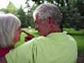 Cute Baby Boomer Couple on Bench | BahVideo.com