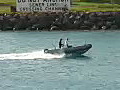 Royalty Free Stock Video HD Footage Small Powerboat Passes by in the Harbor at the Port of Honolulu Hawaii | BahVideo.com