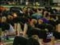 400 People Practice Yoga At Cowboys Stadium | BahVideo.com