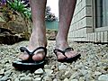 Male feet wearing flip flops | BahVideo.com