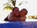 Playful couple in swimming pool  | BahVideo.com