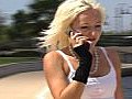 Beautiful Blonde Rollerblading Outdoors With Cell Phone 2 Stock Footage | BahVideo.com