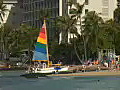 Royalty Free Stock Video HD Footage Catamaran on the Beach at Waikiki in Honolulu Hawaii | BahVideo.com