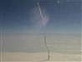 Plane passenger snaps photo of shuttle launch | BahVideo.com