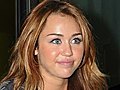 SNTV - Miley all smiley in London | BahVideo.com