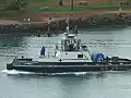 Royalty Free Stock Video HD Footage Tugboat Leaves the Harbor in Honolulu Hawaii | BahVideo.com