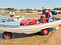 Amphibious vehicle made from lawnmower and rowing boat | BahVideo.com