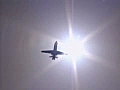 Royalty Free Stock Video SD Footage Jet Plane Flying In Sunny Blue Sky | BahVideo.com