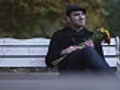 Man on park bench waiting for date looking  | BahVideo.com
