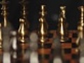 Close-up of hand playing chess dolly shot | BahVideo.com