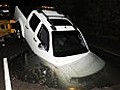 Driver s new truck trapped in water-filled pothole | BahVideo.com