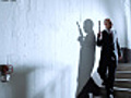 Mr Evil walks down staircase with silenced gun | BahVideo.com