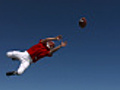Football player catches ball slow motion | BahVideo.com
