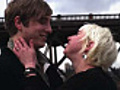 Young couple kiss with bridge in background | BahVideo.com