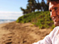 Man sitting on a beach | BahVideo.com