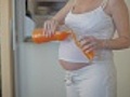 Pregnant woman drinking juice  | BahVideo.com