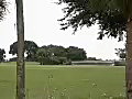 Stock Video Slow Zoom Into Putting Green and Waterfall on a Golf Course in Ft Lauderdale Florida Royalty-Free SD Footage | BahVideo.com