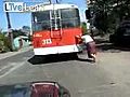 Old Woman Pushes A Broken Trolley Bus | BahVideo.com