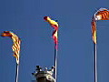 Royalty Free Stock Video HD Footage Zoom Out From Top of Police Office Building and Flags in Barcelona Spain | BahVideo.com