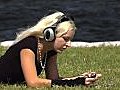 Beautiful Blonde With Headphones Outdoors  | BahVideo.com