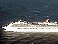Stricken cruise ship towed home | BahVideo.com