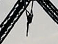 Acrobat Hangs From Bridge | BahVideo.com