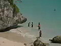 Royalty Free Stock Video SD Footage Zoom Out to From Beach to Coastline and Mayan Ruins at Tulum in Mexico | BahVideo.com