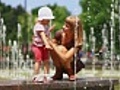 Baby girl and her mother in the fountains  | BahVideo.com