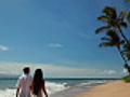 Couple walking on the beach away from camera  | BahVideo.com