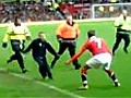 David Beckham apprehends a pitch invader at  | BahVideo.com