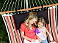 Mother And Daughter Relaxing In A Hammock | BahVideo.com