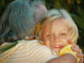 Little girl hugs her grandmother then runs  | BahVideo.com