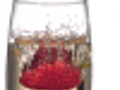 Strawberry splashing into champagne slow motion  | BahVideo.com